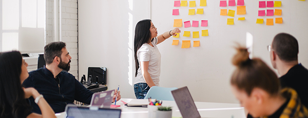 Business meetings group white board post notes 600x230